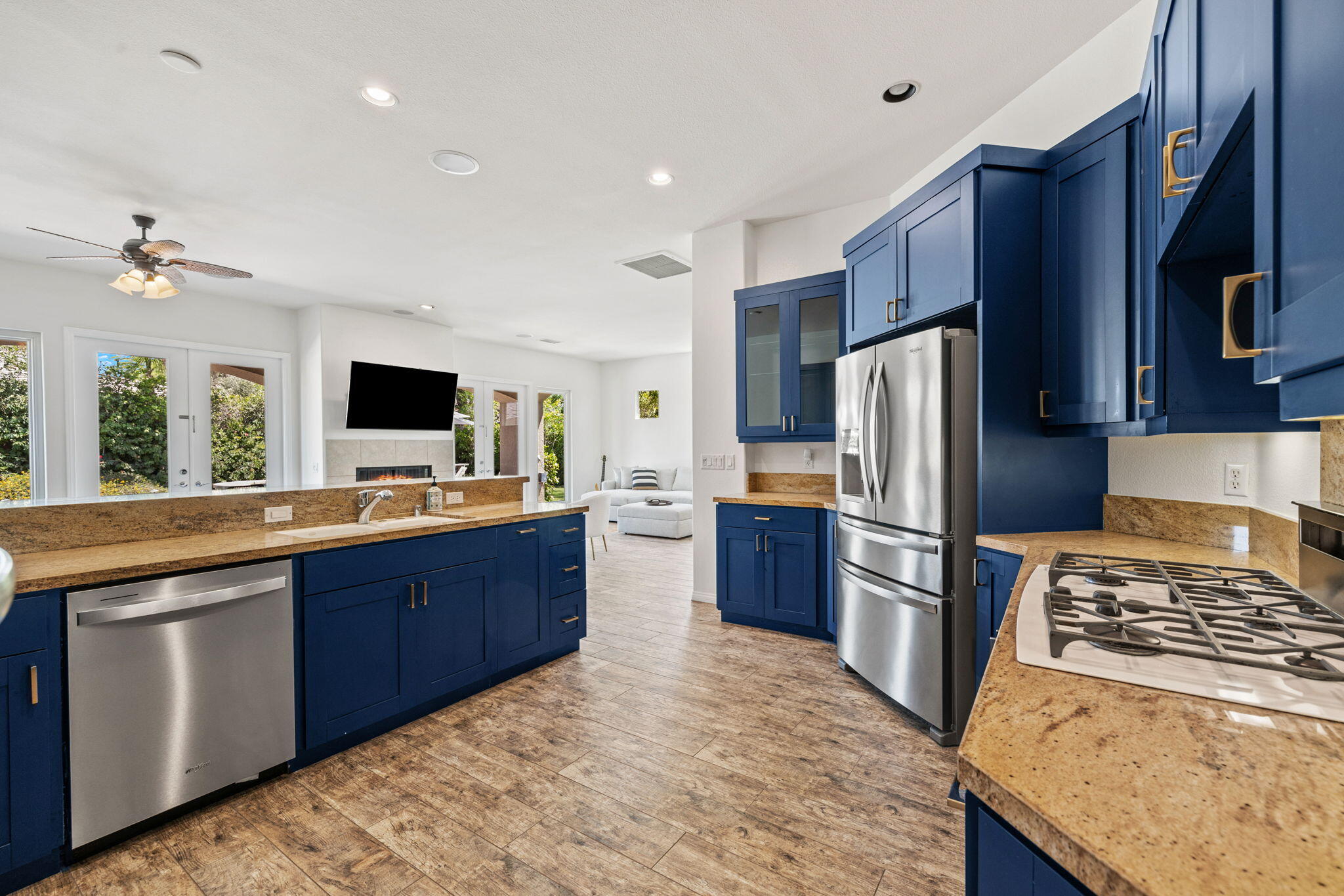 32 Calais Circle Rancho Mirage, CA 92270 - Photo 16 of 56 a kitchen with stainless steel appliances kitchen island granite countertop a refrigerator stove and sink