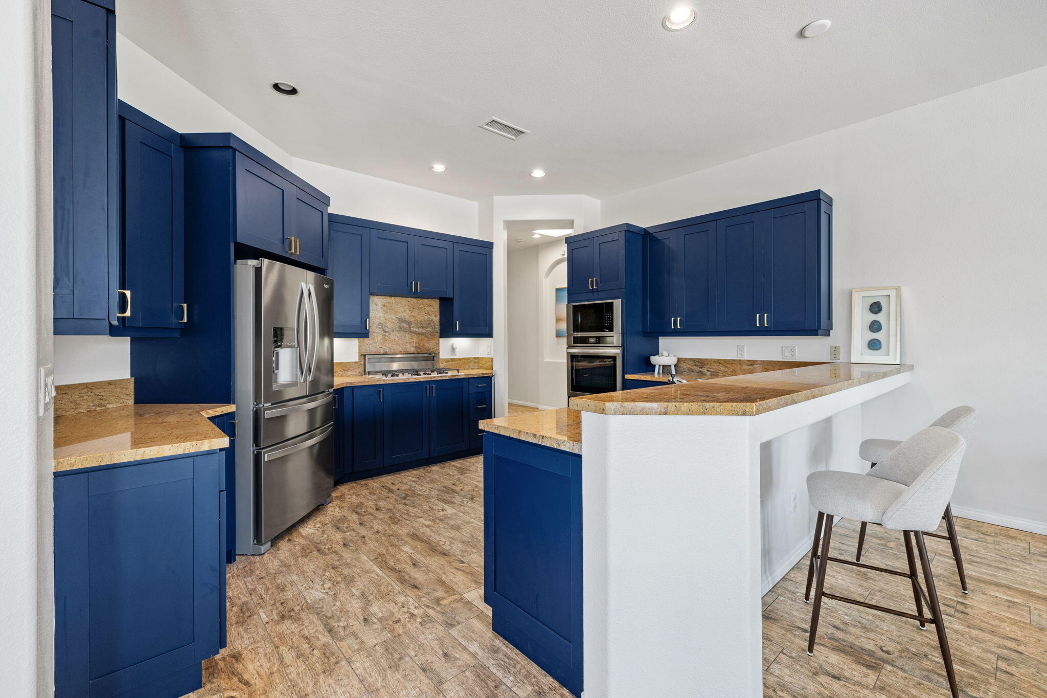 32 Calais Circle Rancho Mirage, CA 92270 - Photo 18 of 56 a kitchen with stainless steel appliances a refrigerator and a stove top oven