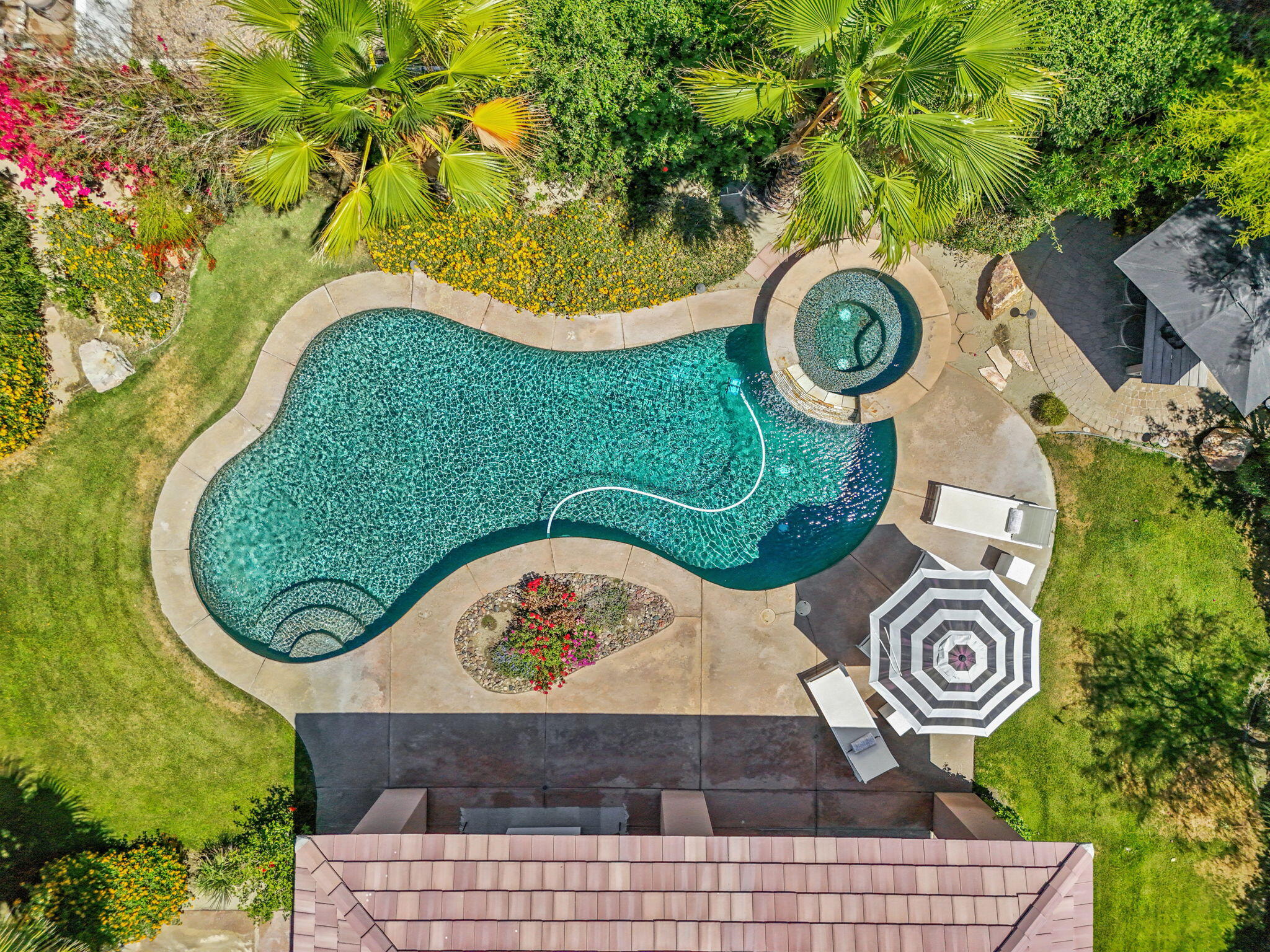 32 Calais Circle Rancho Mirage, CA 92270 - Photo 2 of 56 an aerial view of a wooden table and a stove