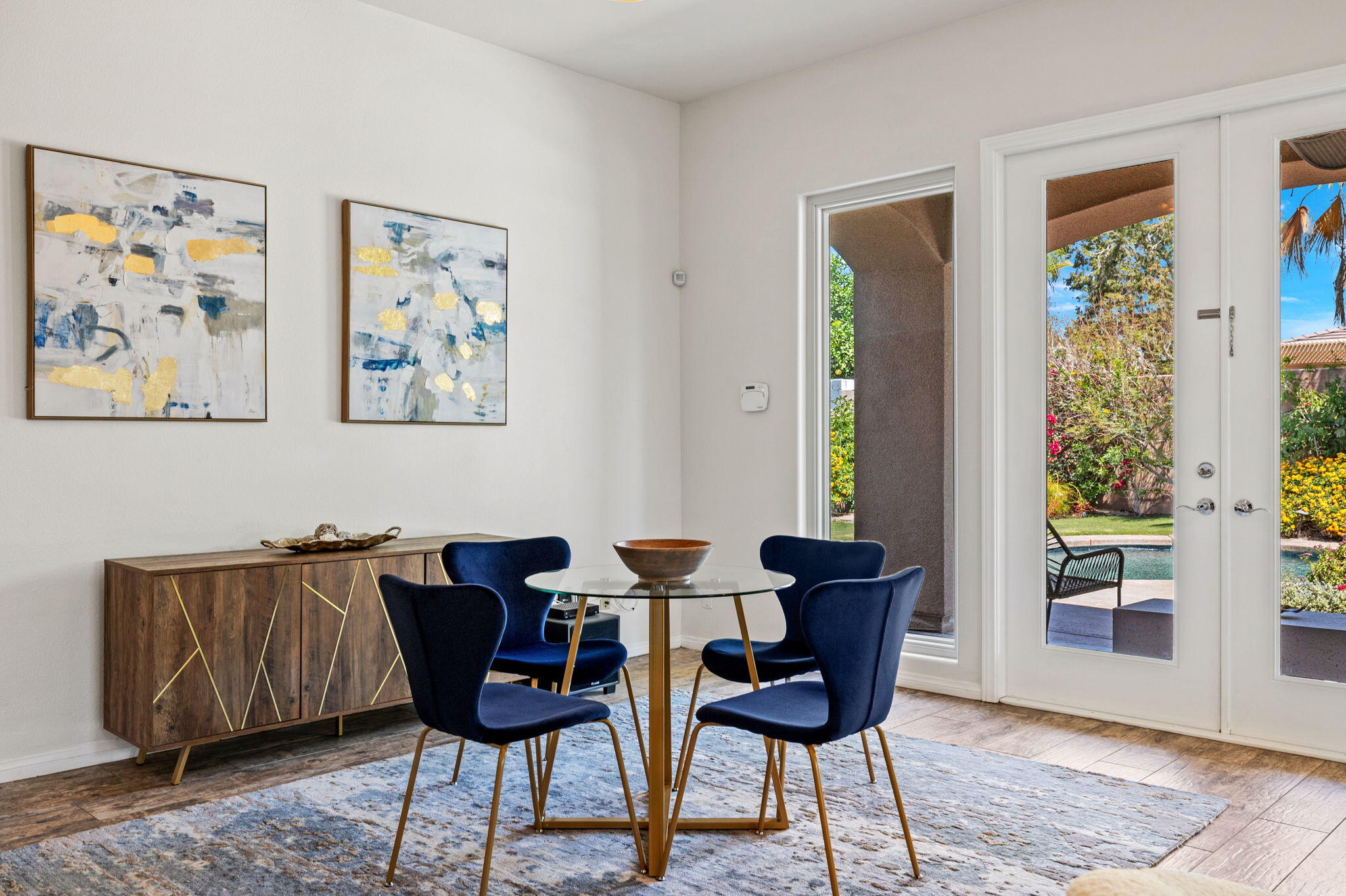 32 Calais Circle Rancho Mirage, CA 92270 - Photo 21 of 56 a view of a dining room with furniture window and wooden floor