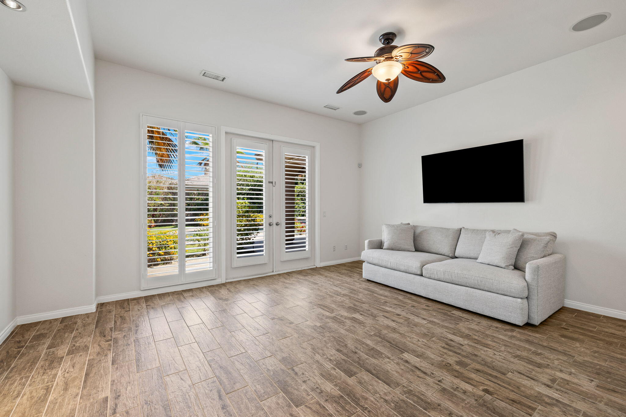 32 Calais Circle Rancho Mirage, CA 92270 - Photo 23 of 56 a living room with furniture and a flat screen tv