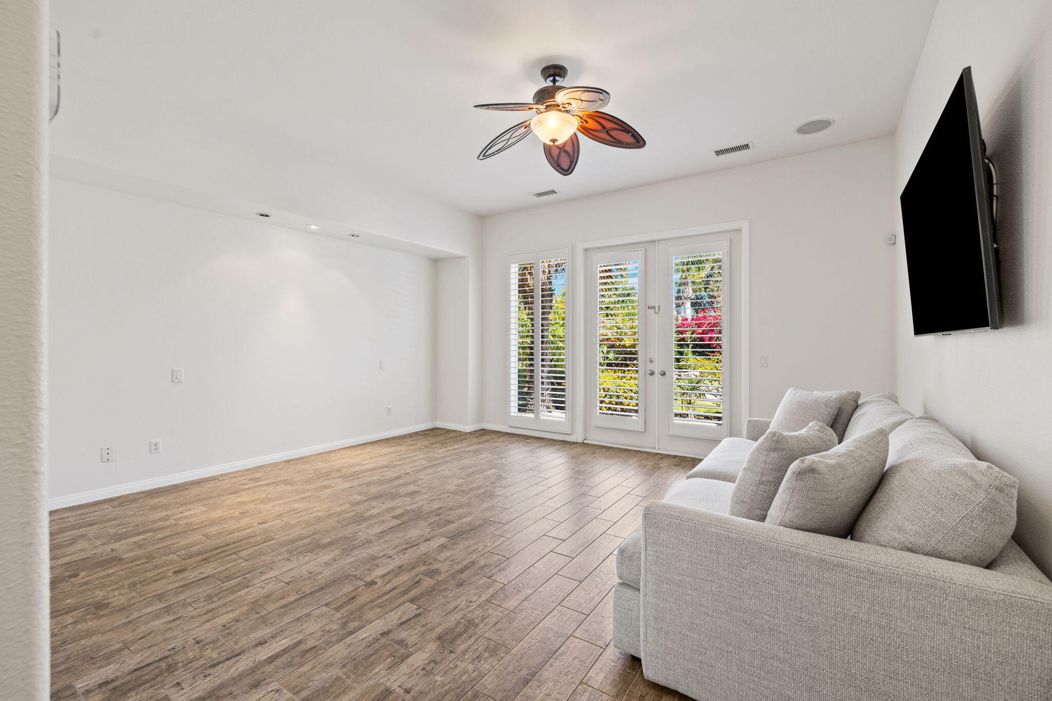 32 Calais Circle Rancho Mirage, CA 92270 - Photo 24 of 56 a living room with furniture and a flat screen tv