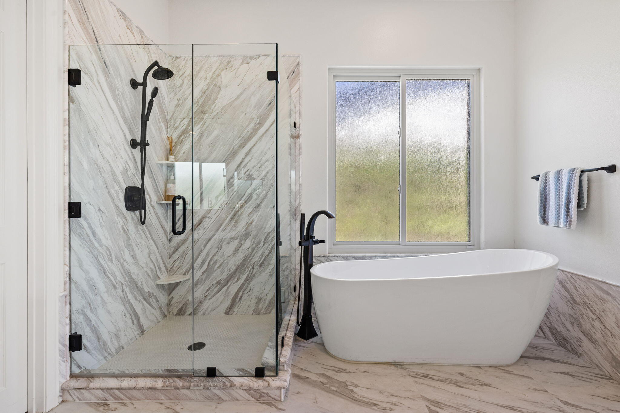 32 Calais Circle Rancho Mirage, CA 92270 - Photo 28 of 56 a white tub sitting next to a shower