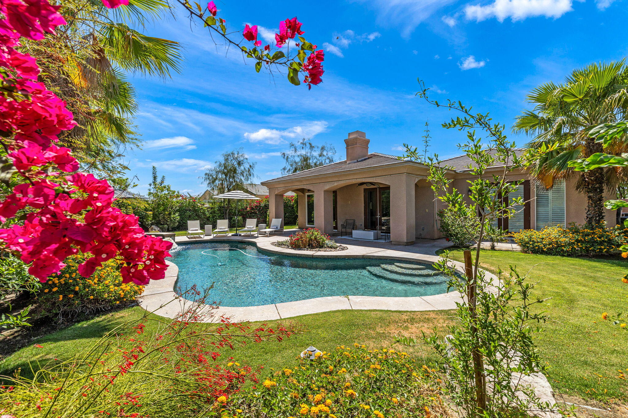 32 Calais Circle Rancho Mirage, CA 92270 - Photo 46 of 56 a view of a house with swimming pool