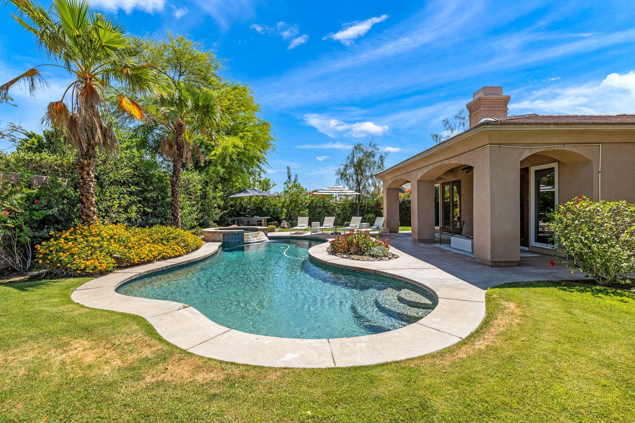32 Calais Circle Rancho Mirage, CA 92270 - Photo 47 of 56 a view of a house with swimming pool