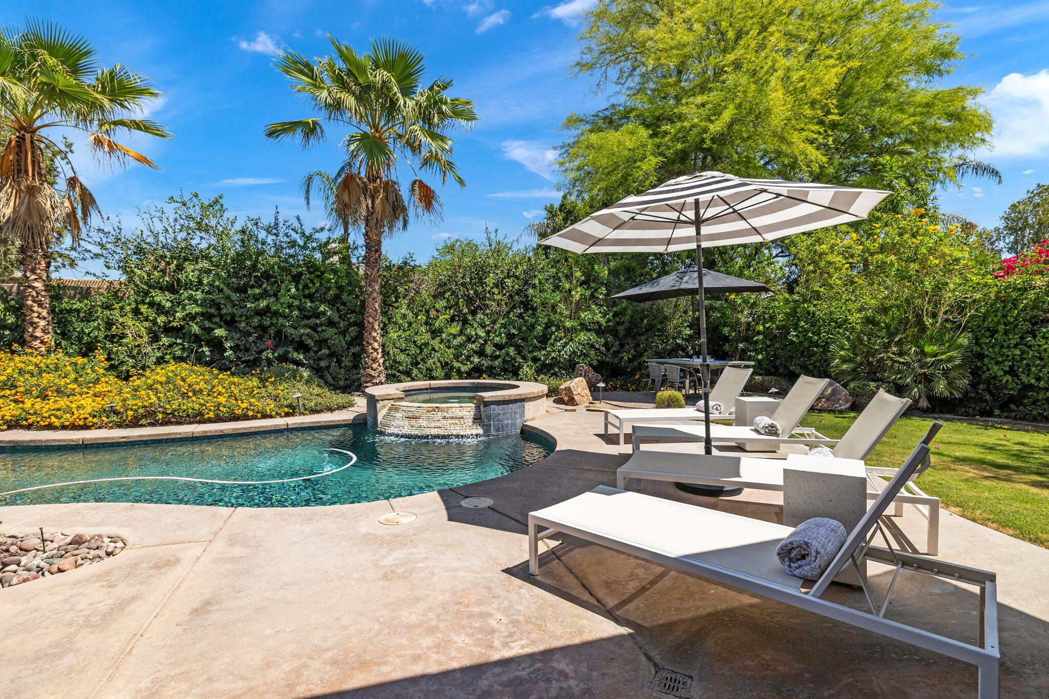 32 Calais Circle Rancho Mirage, CA 92270 - Photo 52 of 56 a view of backyard with outdoor seating and trees