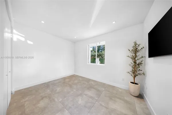 a view of a room with a potted plant and a window