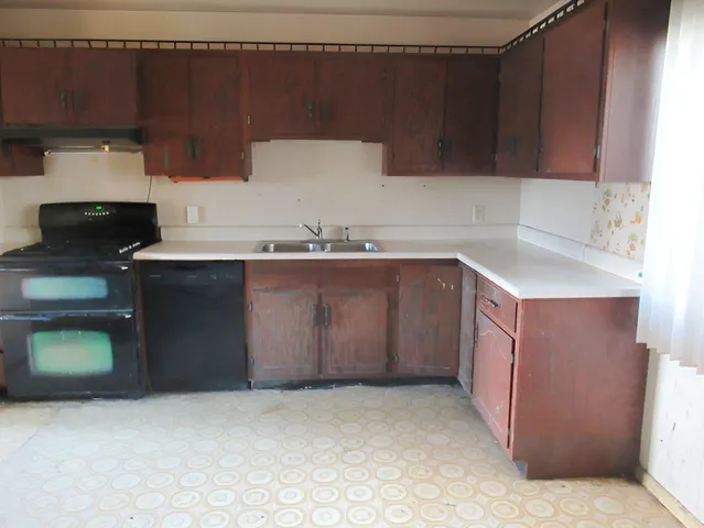 a kitchen with a sink and cabinets
