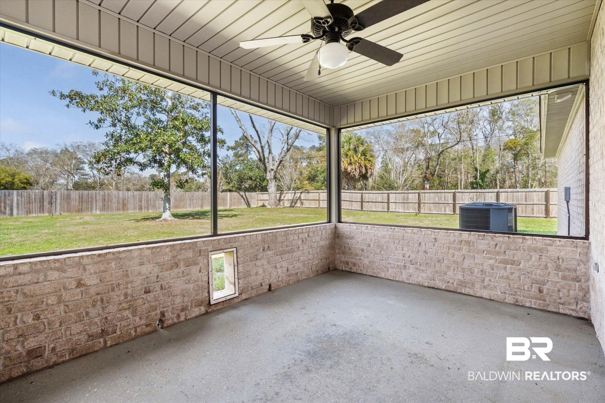 101 Washington Boulevard Foley, AL 36535 - Photo 24 of 32 Unfurnished sunroom featuring a ceiling fan and a patio