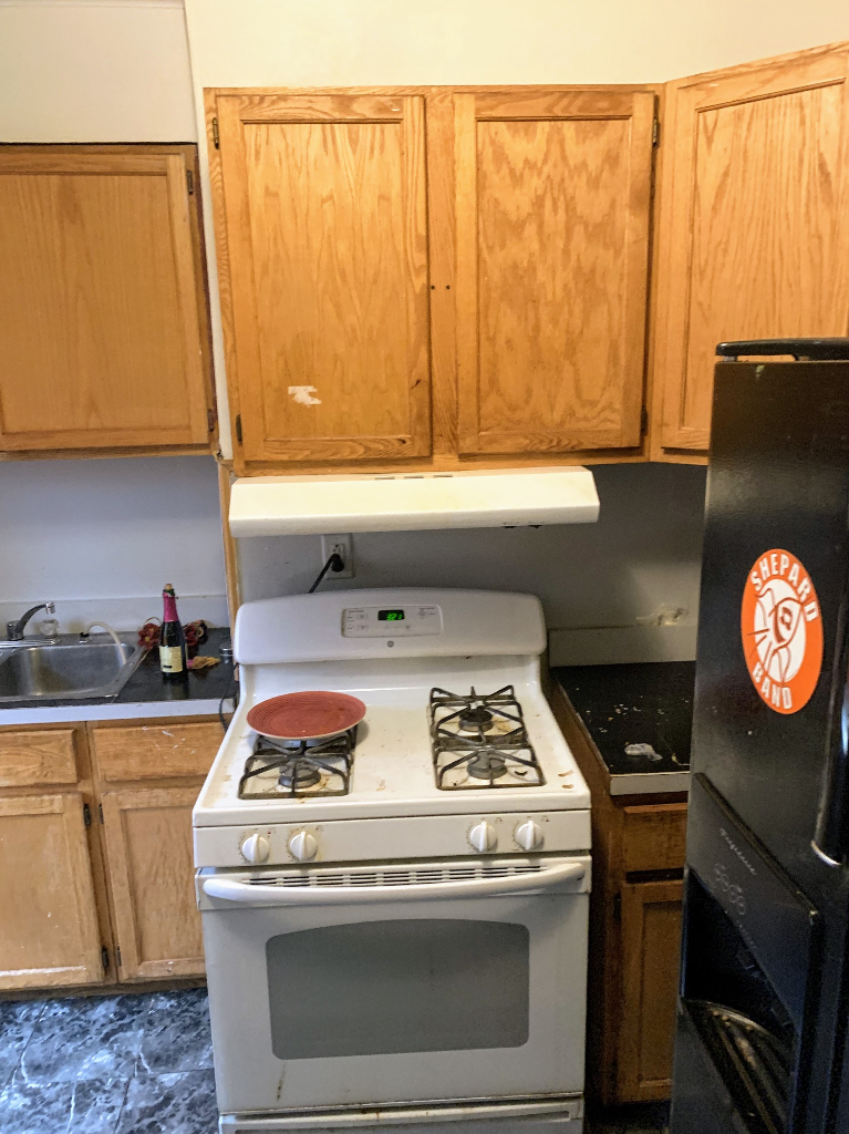 104 Pulaski Road Calumet City, IL 60409 - Photo 6 of 21 a stove top oven sitting inside of a kitchen