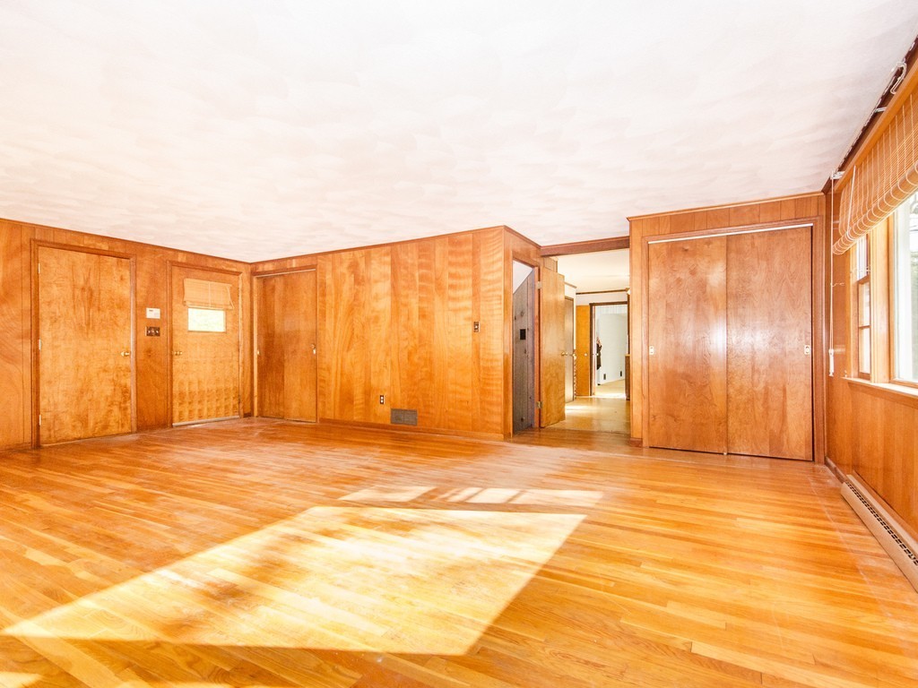 3 Trickett Road Lynnfield, MA 01940 - Photo 14 of 24 a view of a livingroom with an empty space and a window