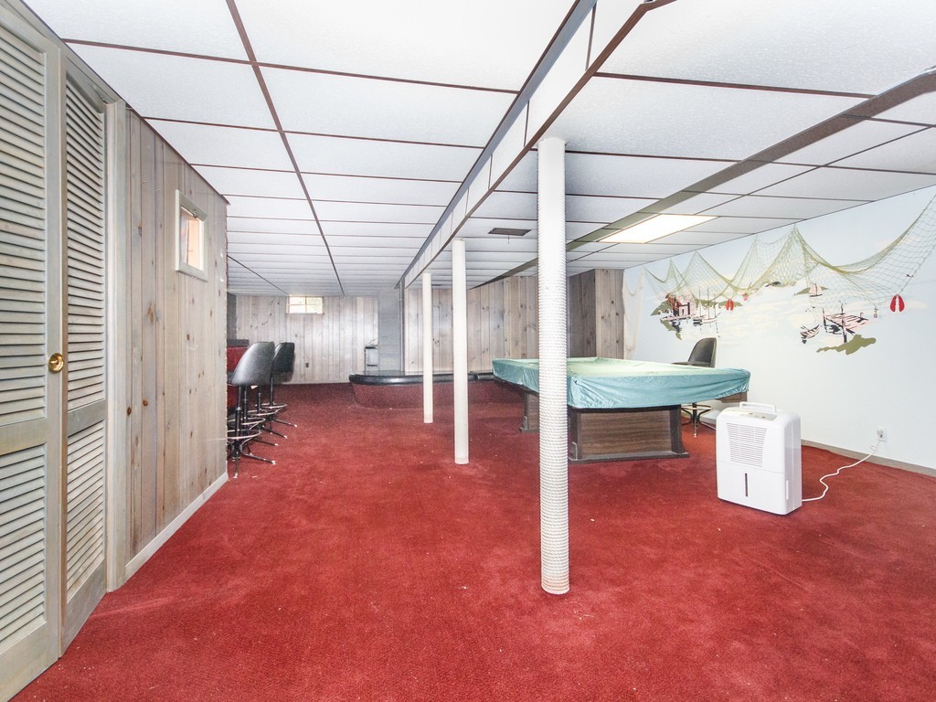 3 Trickett Road Lynnfield, MA 01940 - Photo 18 of 24 a view of a room with wooden floor and couches