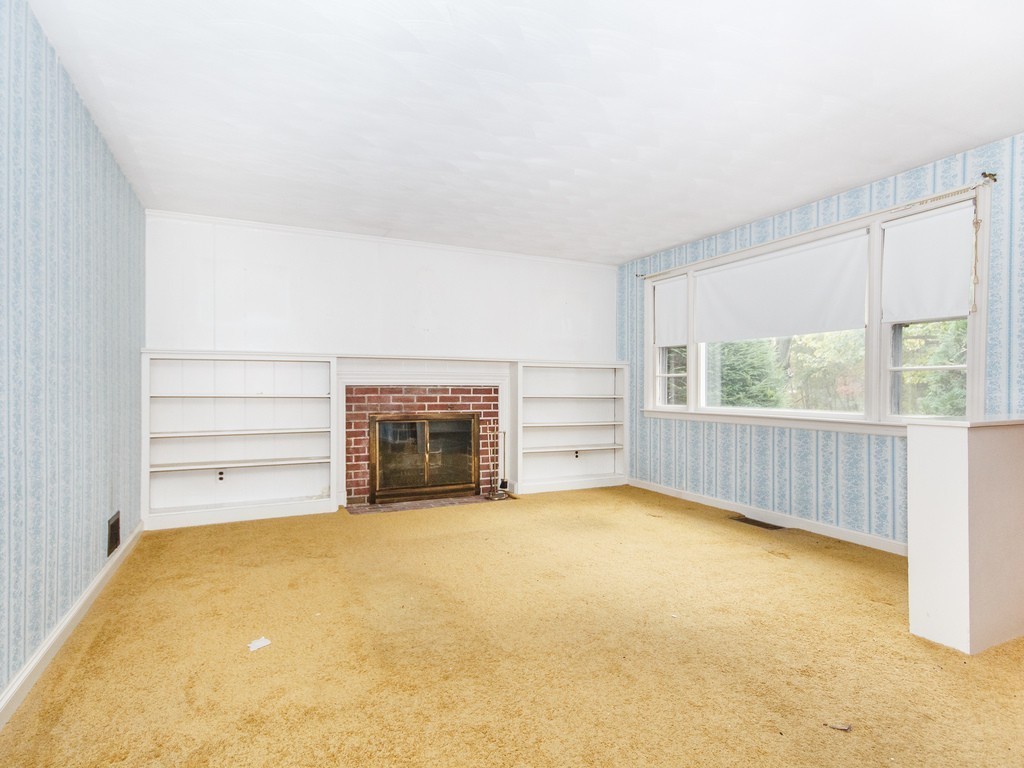 3 Trickett Road Lynnfield, MA 01940 - Photo 3 of 24 an empty room with a fireplace