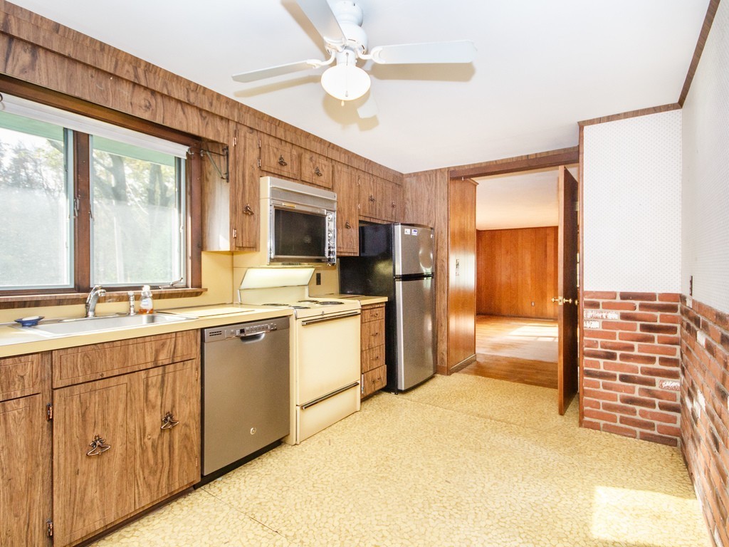 3 Trickett Road Lynnfield, MA 01940 - Photo 6 of 24 a kitchen with sink cabinets and refrigerator