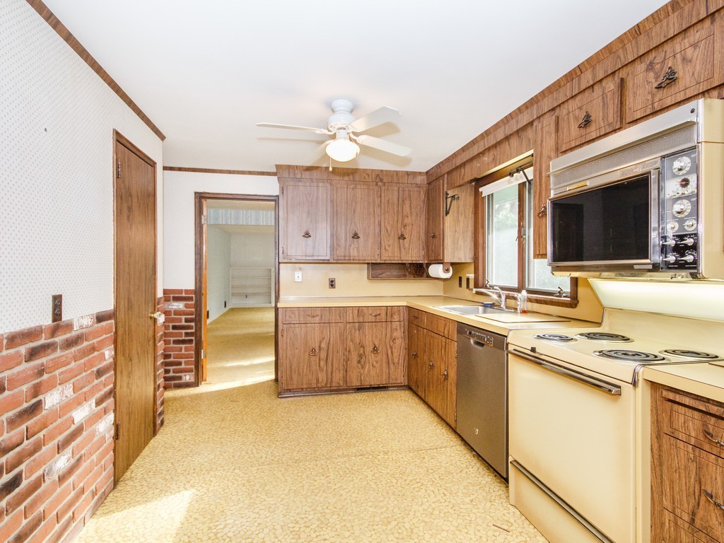 3 Trickett Road Lynnfield, MA 01940 - Photo 7 of 24 a kitchen with stainless steel appliances granite countertop a stove and a sink