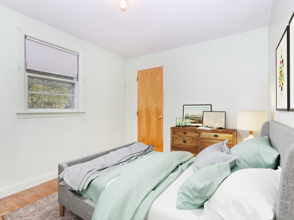 3 Trickett Road Lynnfield, MA 01940 - Photo 10 of 24 a bedroom with a bed and wooden floor