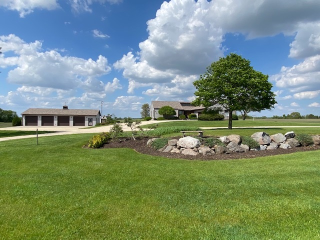 a view of a house with a big yard