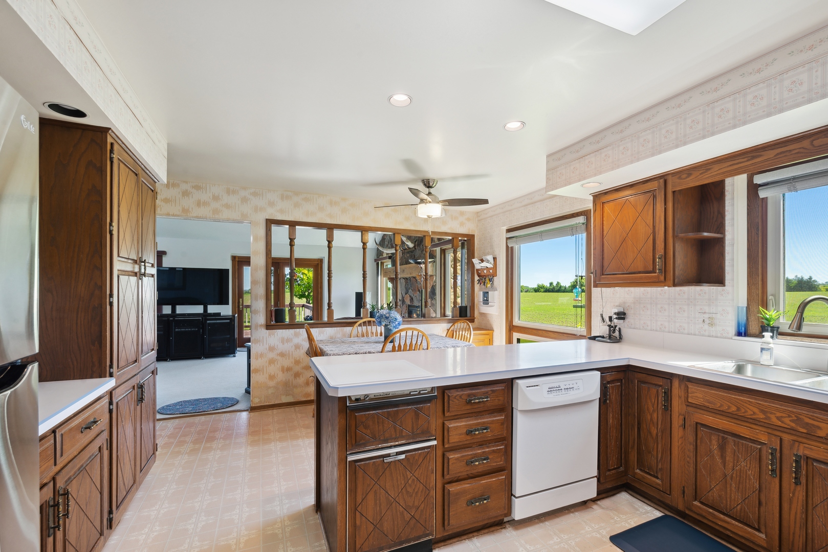 19720 Hebron Road Harvard, IL 60033 - Photo 20 of 41 a large kitchen with kitchen island granite countertop a large counter top appliances and cabinets