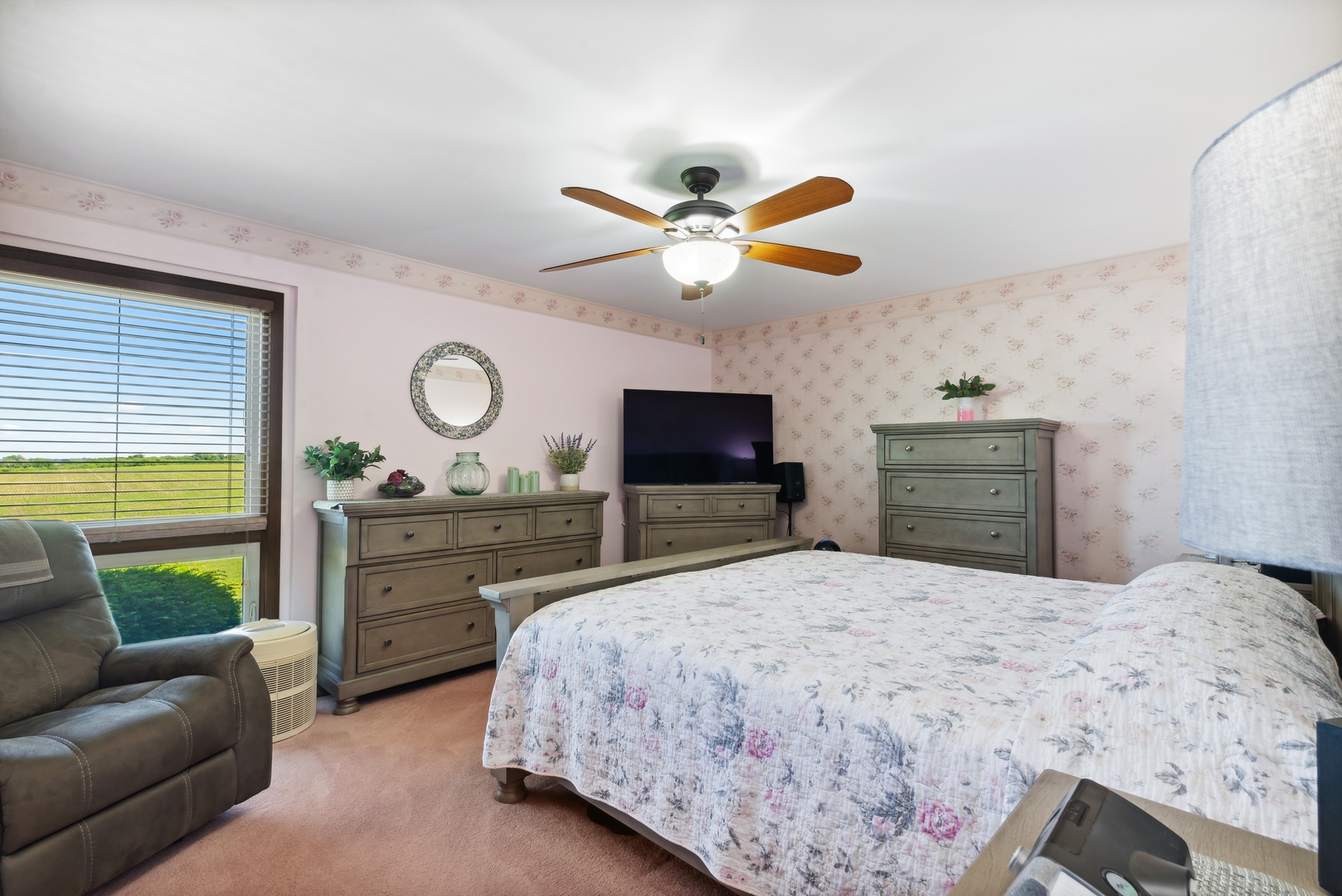 19720 Hebron Road Harvard, IL 60033 - Photo 24 of 41 a bedroom with a bed a couch and a flat screen tv