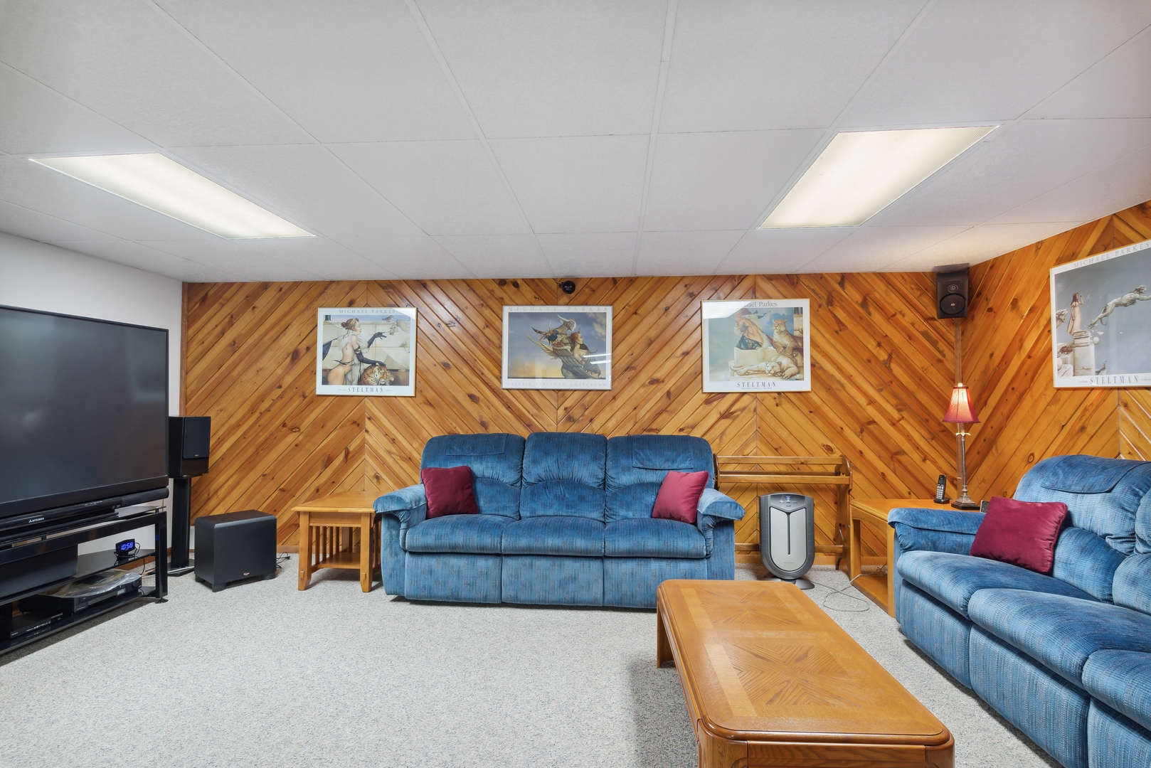 19720 Hebron Road Harvard, IL 60033 - Photo 27 of 41 a living room with furniture a flat screen tv and a wall painting