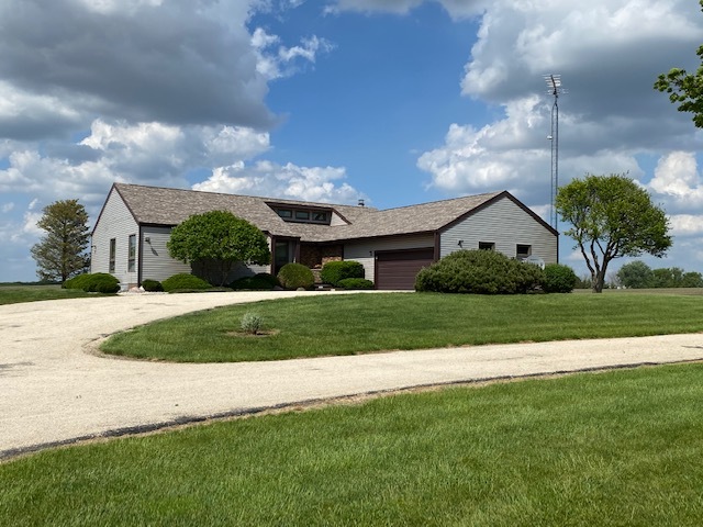 19720 Hebron Road Harvard, IL 60033 - Photo 3 of 41 a view of a house next to a yard