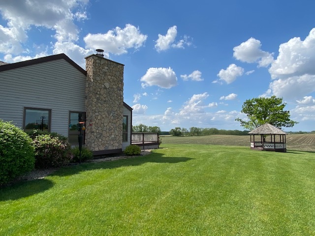19720 Hebron Road Harvard, IL 60033 - Photo 8 of 41 a backyard of a house with lots of green space