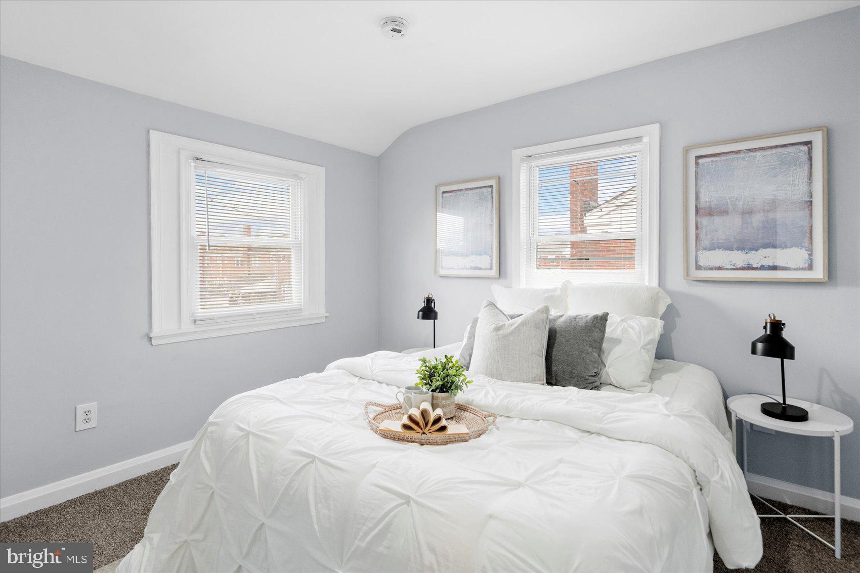 8411 Kavanagh Road Baltimore, MD 21222 - Photo 20 of 48 a bedroom with a bed and a table