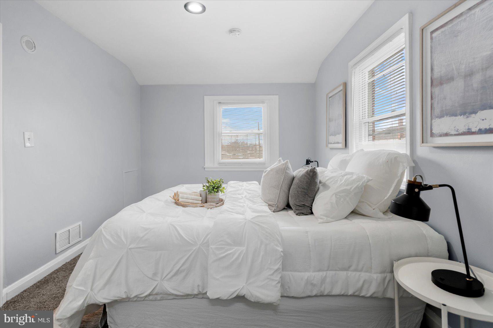 8411 Kavanagh Road Baltimore, MD 21222 - Photo 22 of 48 a large white bed in a white room