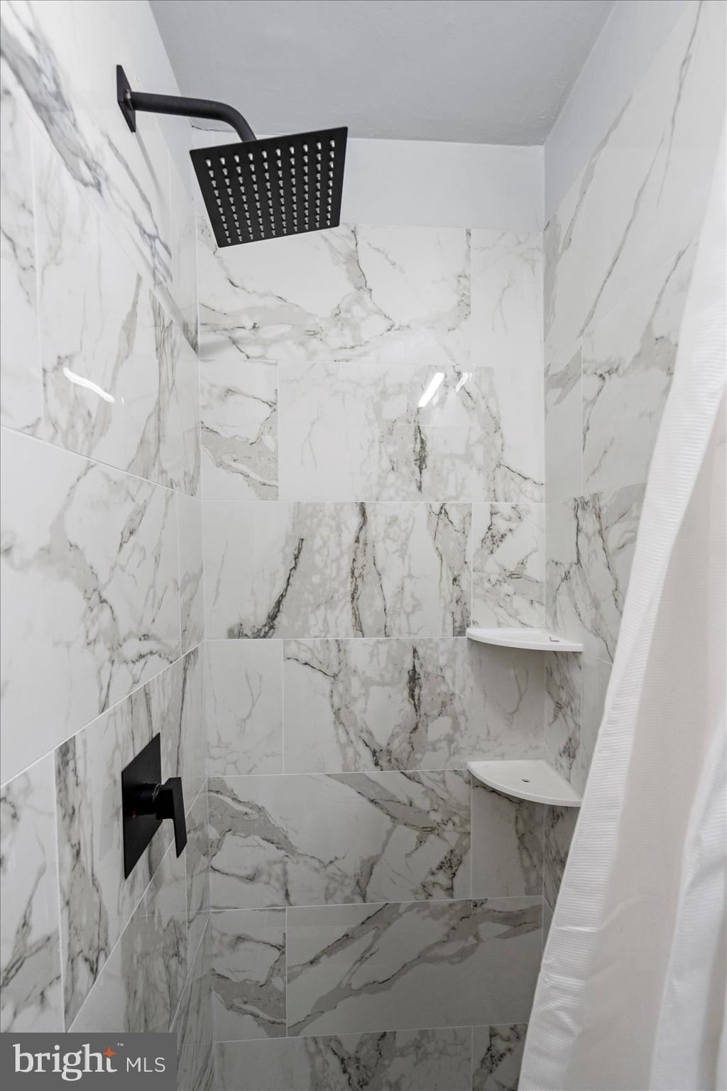 8411 Kavanagh Road Baltimore, MD 21222 - Photo 24 of 48 a bathroom with a bathtub and shower