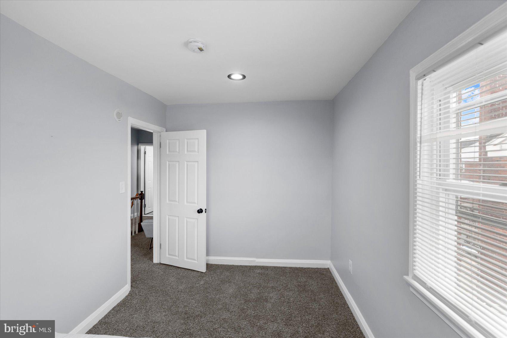 8411 Kavanagh Road Baltimore, MD 21222 - Photo 27 of 48 a view of an empty room with a window