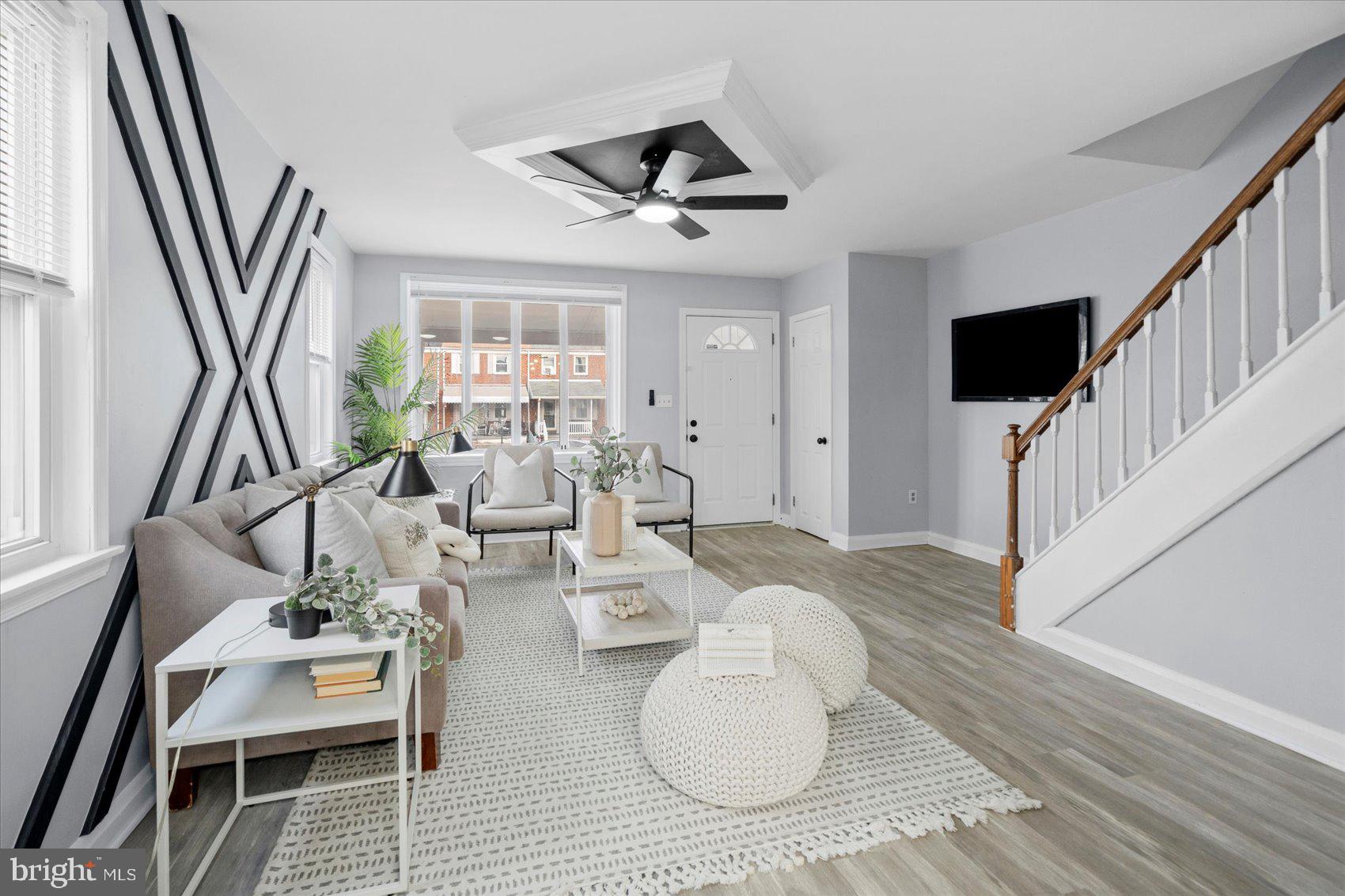 8411 Kavanagh Road Baltimore, MD 21222 - Photo 6 of 48 a living room with furniture and a flat screen tv