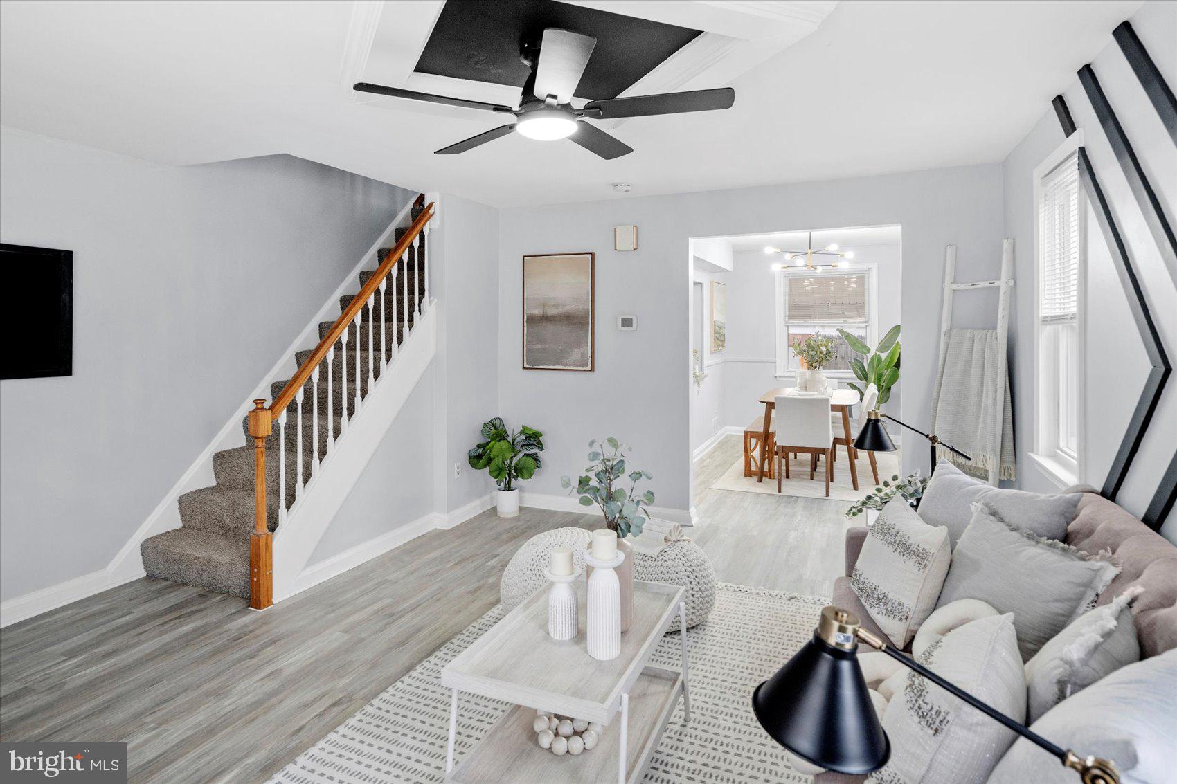 8411 Kavanagh Road Baltimore, MD 21222 - Photo 7 of 48 a living room with furniture and a wooden floor