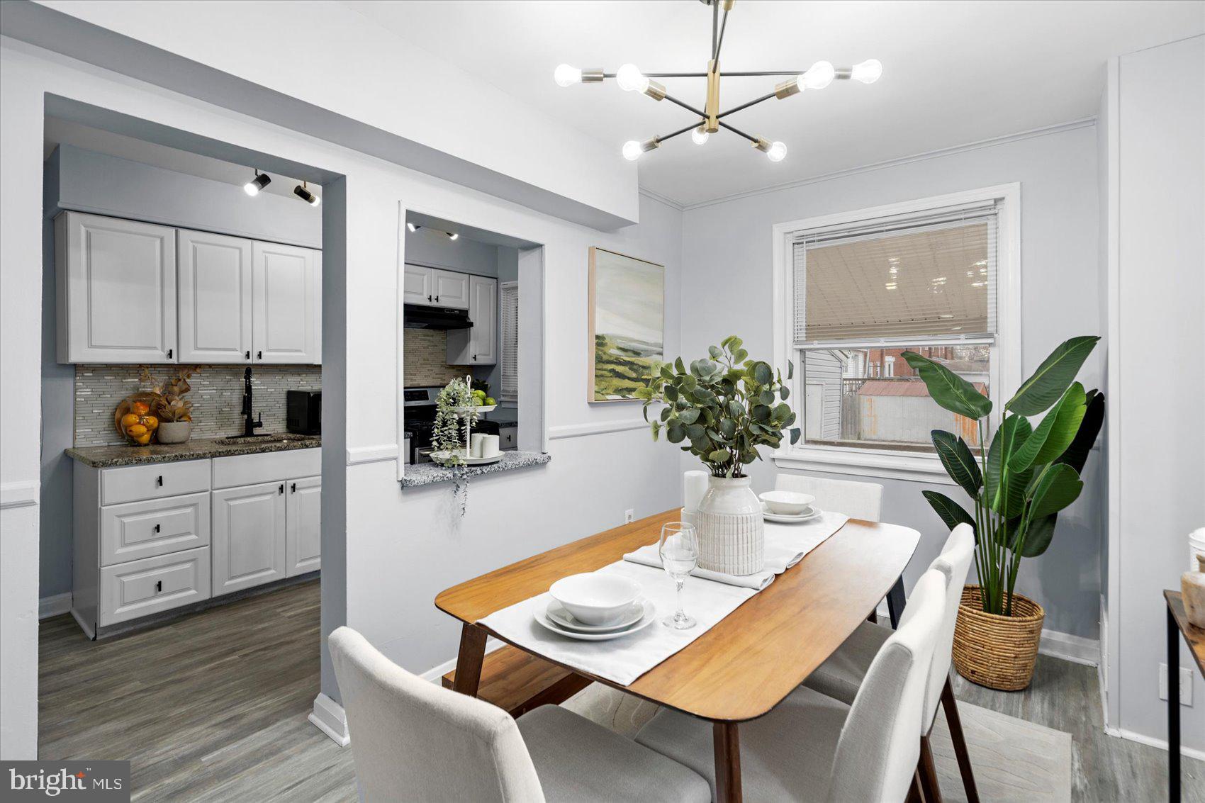 8411 Kavanagh Road Baltimore, MD 21222 - Photo 8 of 48 a view of a dining room with furniture window and wooden floor