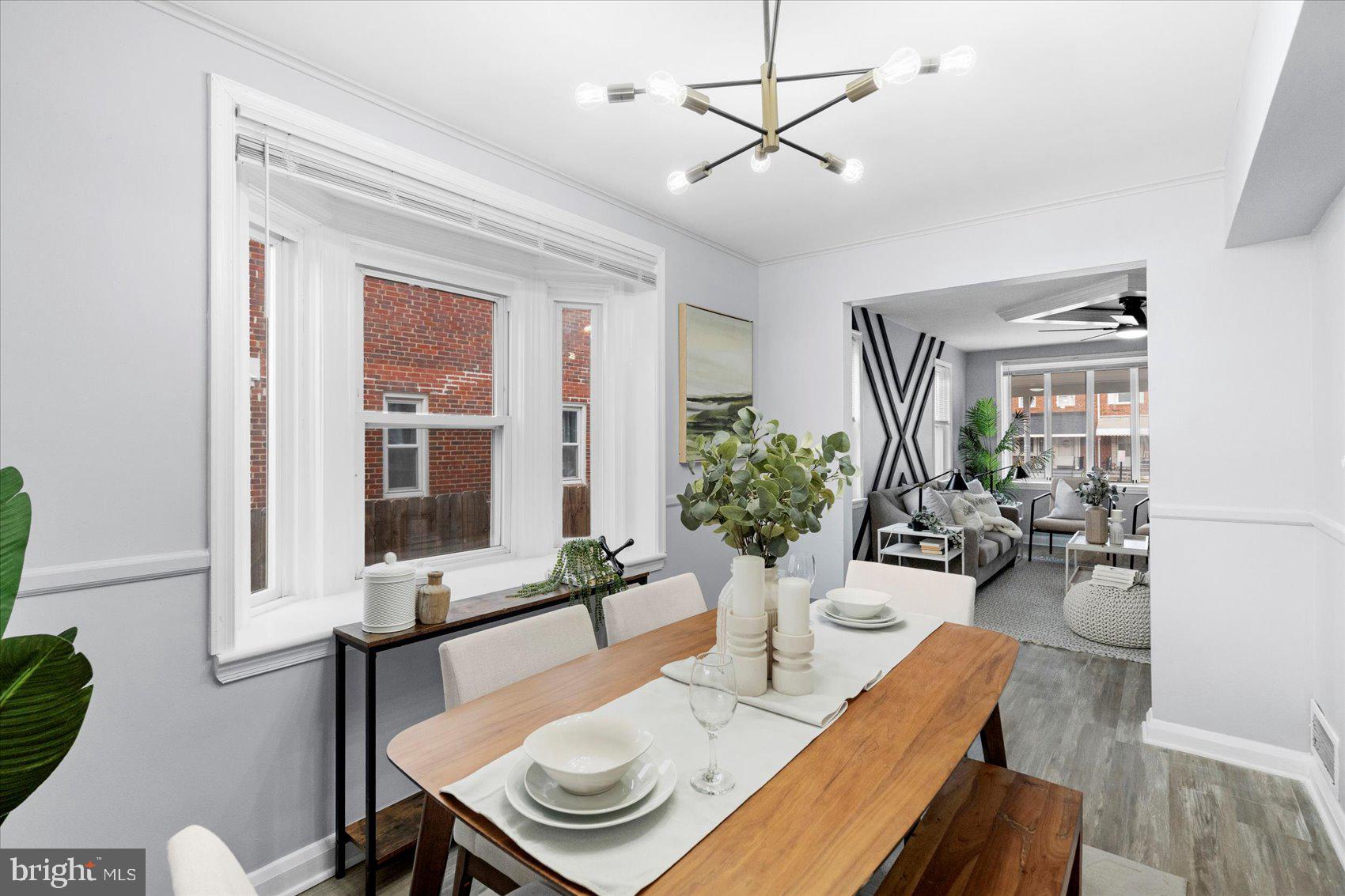 8411 Kavanagh Road Baltimore, MD 21222 - Photo 10 of 48 a view of a dining room with furniture window and wooden floor