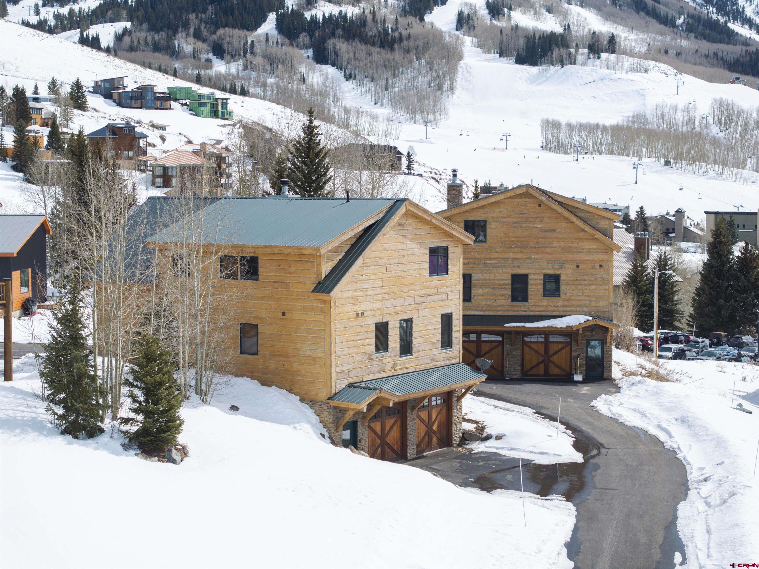 720 Gothic Road, Unit 3 Crested Butte, CO 81225 - Photo 29 of 29 a view of a house with a yard covered in snow