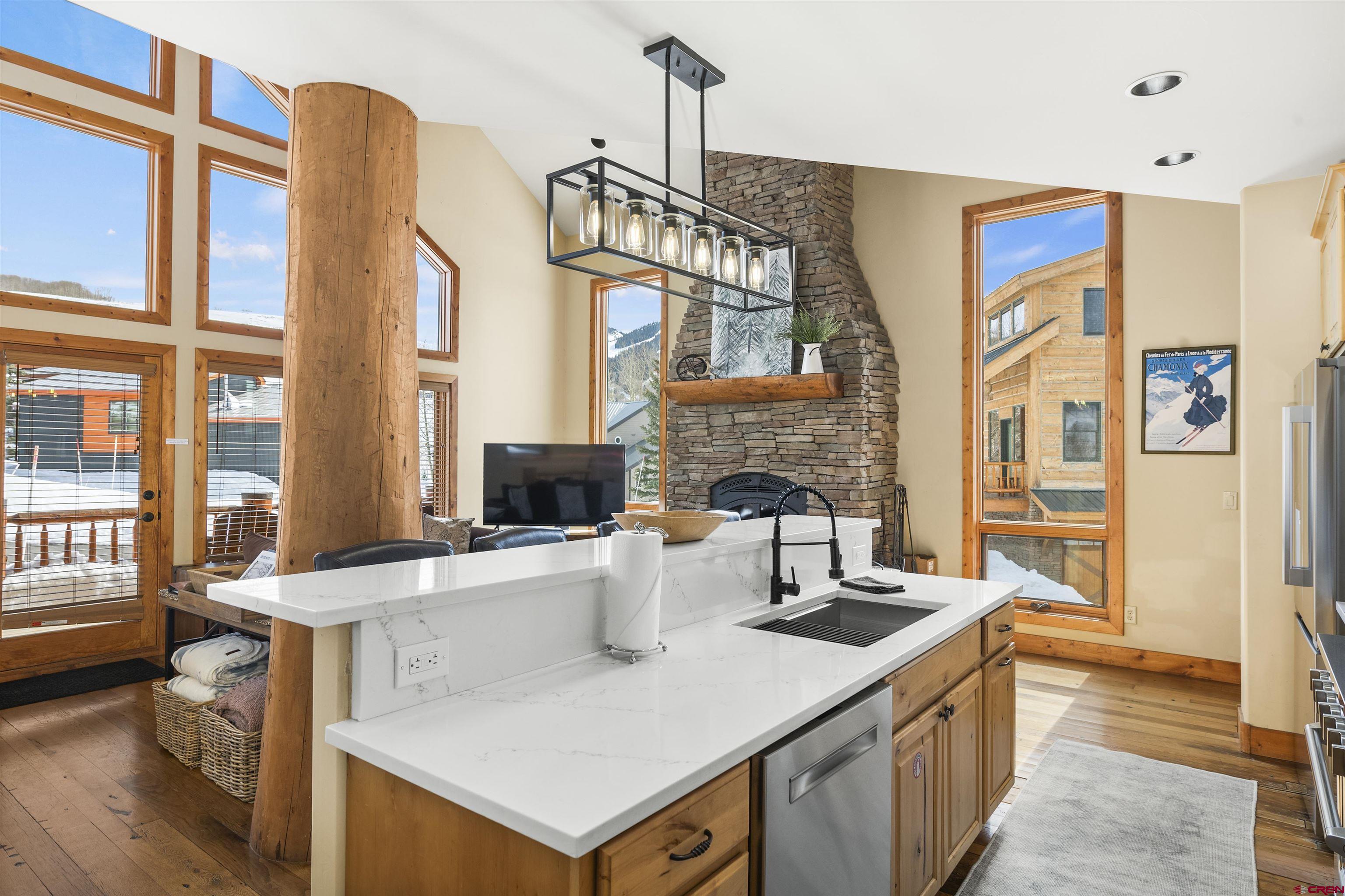 720 Gothic Road, Unit 3 Crested Butte, CO 81225 - Photo 5 of 29 a view of living room filled with furniture and large windows