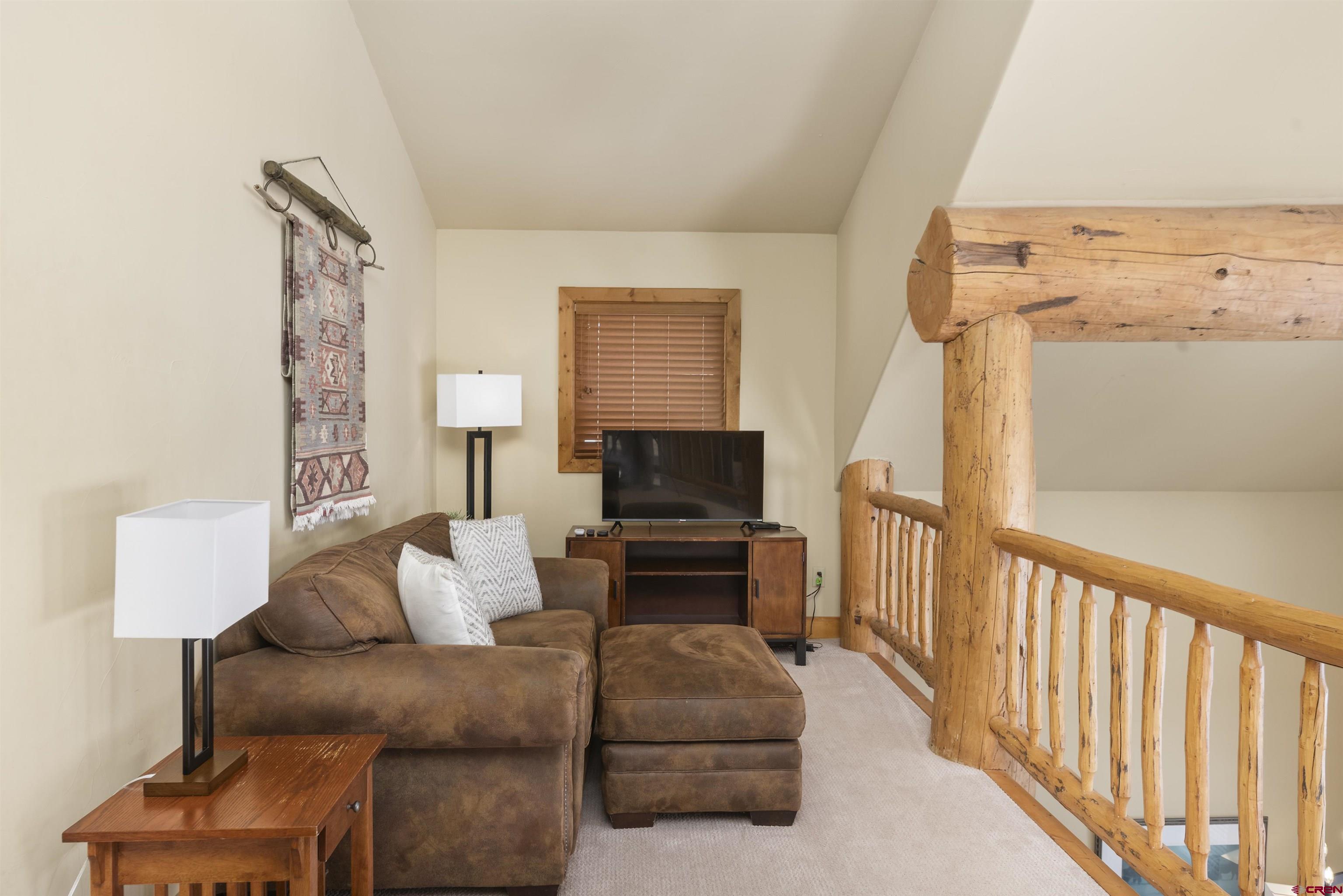 720 Gothic Road, Unit 3 Crested Butte, CO 81225 - Photo 10 of 29 a living room with furniture and a couch