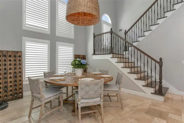 a view of a dining room with furniture and a window