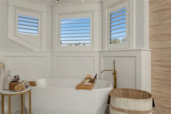 a bedroom with furniture and a flat screen tv