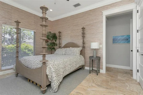 a view of a workspace with furniture and a bookshelf