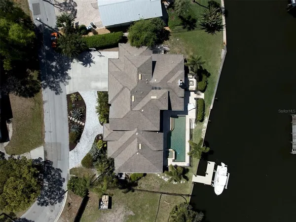 an aerial view of a house with outdoor space