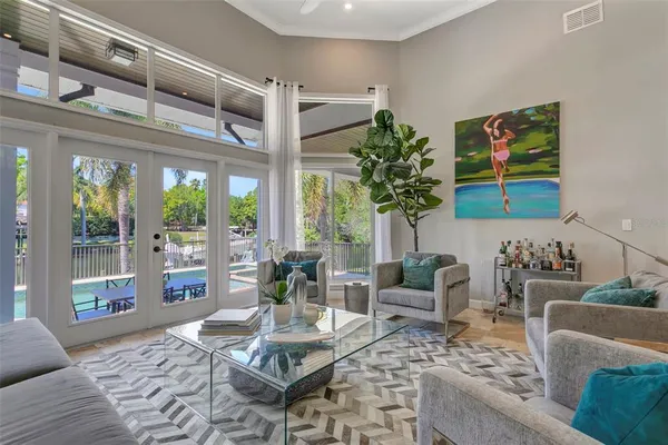 a living room with furniture and a large window
