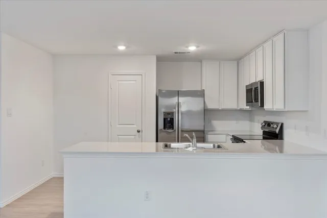 a bathroom with double vanity sink and mirror