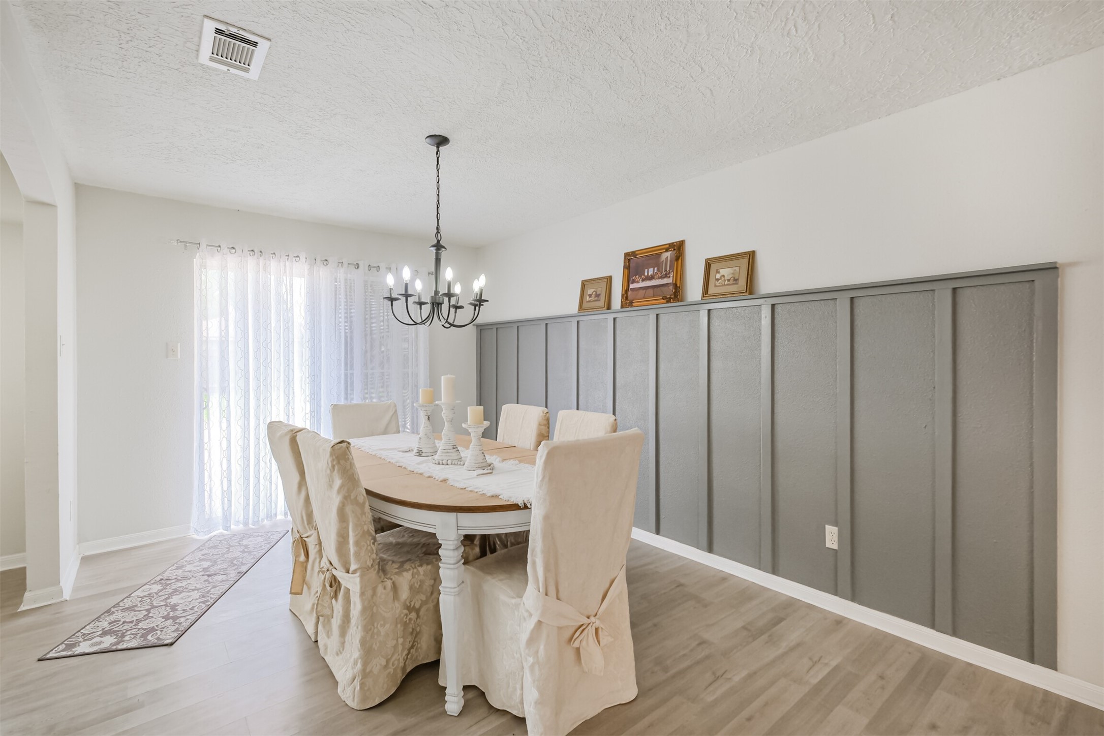 2705 Parrott Avenue Rosenberg, TX 77471 - Photo 13 of 37 a view of a dining room with furniture window and wooden floor