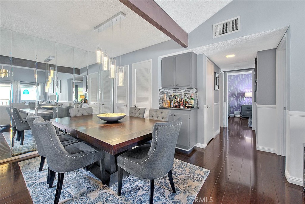 44 Carriage Way, Unit 108 Pomona, CA 91766 - Photo 13 of 44 a dining room with furniture and wooden floor