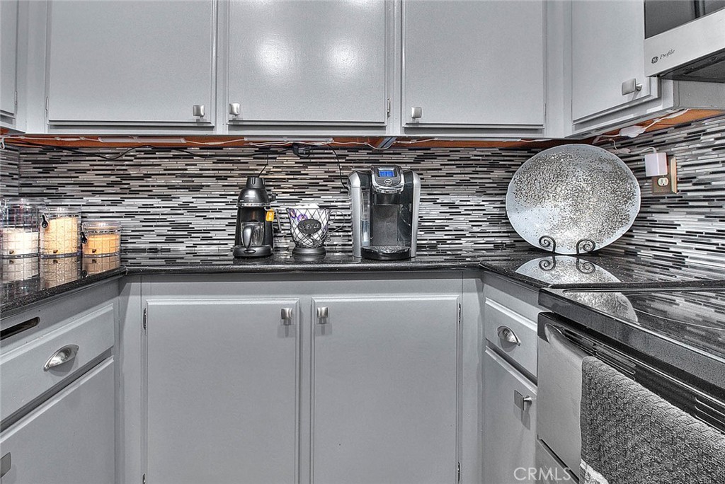 44 Carriage Way, Unit 108 Pomona, CA 91766 - Photo 19 of 44 a kitchen with a sink and cabinets