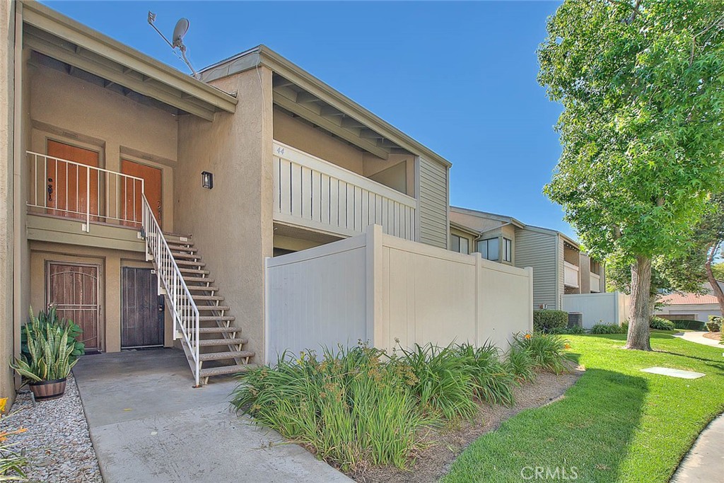 44 Carriage Way, Unit 108 Pomona, CA 91766 - Photo 2 of 44 a view of a house with a yard