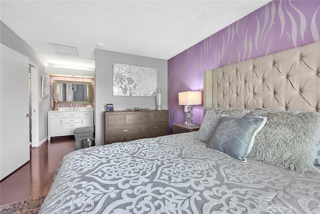 44 Carriage Way, Unit 108 Pomona, CA 91766 - Photo 23 of 44 a bedroom with a bed and a view of kitchen