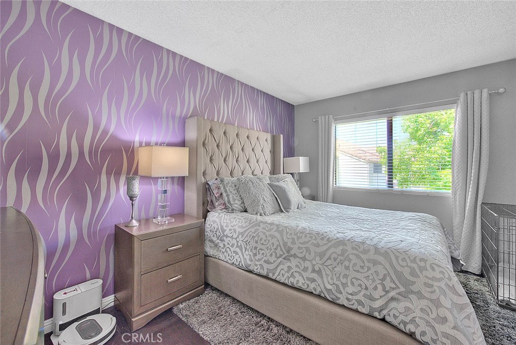 44 Carriage Way, Unit 108 Pomona, CA 91766 - Photo 24 of 44 a bedroom with a bed and a window