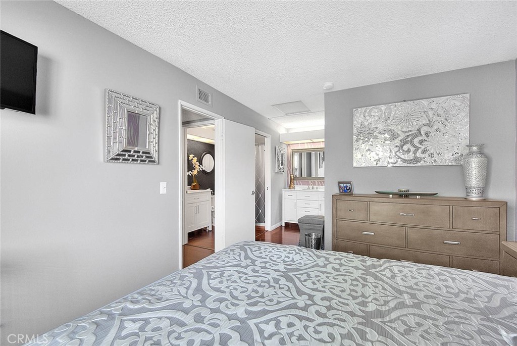 44 Carriage Way, Unit 108 Pomona, CA 91766 - Photo 25 of 44 a room with a bed and a dresser
